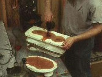 Next, wax is poured into the rubber mold to create the sculpture in wax.